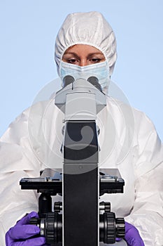Biochemist looking at a microscope photo