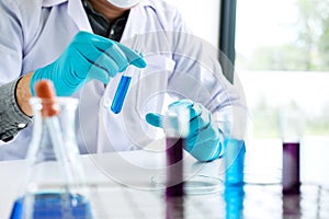 Biochemistry laboratory research, Chemist is analyzing sample in