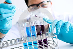 Biochemistry laboratory research, Chemist is analyzing sample in