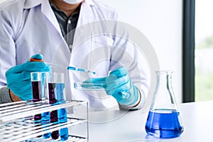 Biochemistry laboratory research, Chemist is analyzing sample in