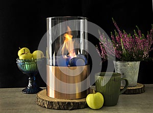 Bioethanol fueled portable fireplace burning at home, for live fire at home, no chimney and mantelpiece is needed.