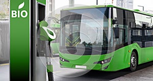 Biofuel filling station on a background of green city bus. Decarbonization of public transport photo