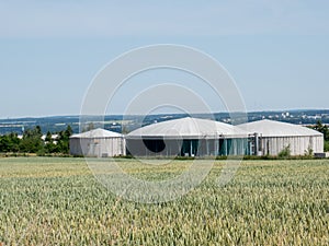 Biogas plant in Germany with grain field