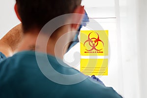 Biohazard symbol sign of biological threat alert, black yellow triangle signage text