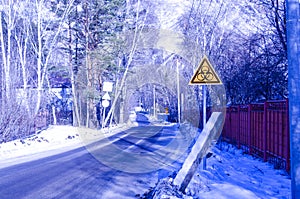 Biohazard warning sign on the background of a streetscape