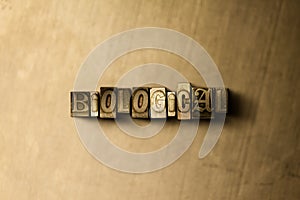 BIOLOGICAL - close-up of grungy vintage typeset word on metal backdrop