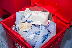 Biological risk waste disposed of in the red trash bag at a operating room