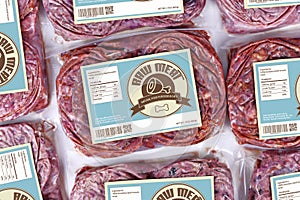 Biologically appropriate raw food for dogs or cats in packaging containing raw frozen beef meat with label