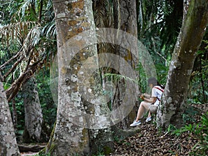 Biologist botanist asian girl outdoor activity with lifestyle in rainforest