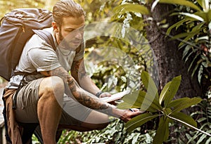 Biologist in a forest trekking