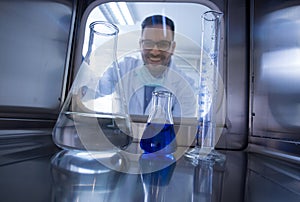 Biologist looking at samples in incubator in laboratory