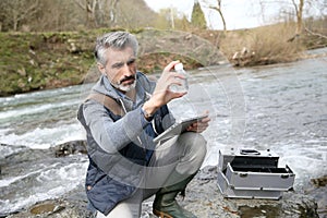 Biologist making research outdoors