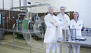 Biologist team with arms crossed smiling at camera