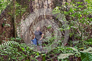 Biologist Woman Standing Next To A Kapok Tree