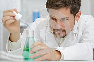 Biologist working in petri dishes in lab