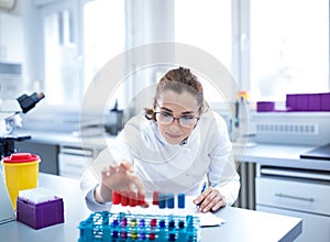 Biologist working with test tubes