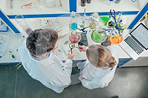 Biologists working in lab with tubes photo