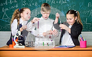 Biology education. Little kids learning chemistry in lab. students doing biology experiments with microscope in lab