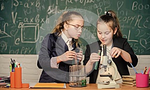 Biology lab. Happy Genius. Little girls scientist with microscope. Little girls genius in school lab. Science lab