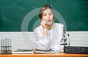 Biology student sit classroom chalkboard background. Education concept. Woman pretty adorable teacher or student