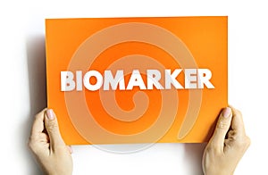 Biomarker - is a measurable indicator of some biological state or condition, text concept on card photo