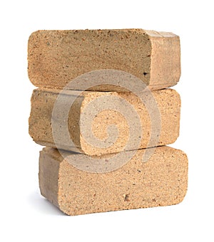 Biomass briquettes are a biofuel substitute to coal and charcoal photo