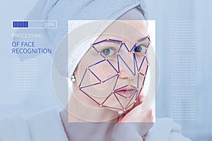 Biometric verification of a modern young woman. New technology of face recognition on polygonal grid