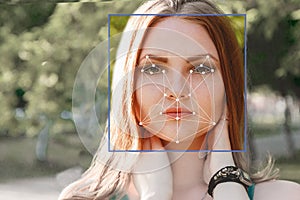 Biometric verification. young woman. The concept of a new technology of face recognition on polygonal grid.