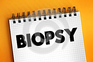 Biopsy - extraction of sample cells for examination to determine the presence or extent of a disease, text concept on notepad