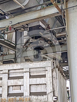 Biosolids structure distributing recycled sludge to a dump truck