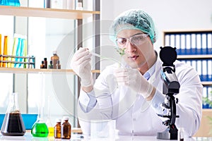 The biotechnology concept with scientist in lab