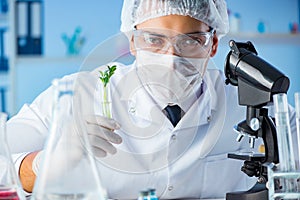 The biotechnology concept with scientist in lab