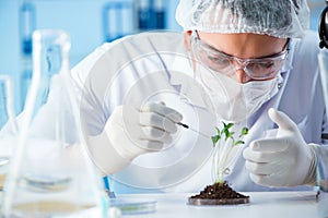 The biotechnology concept with scientist in lab