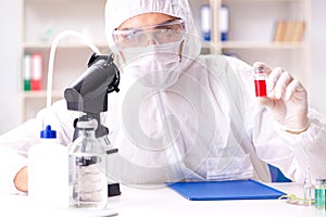 The biotechnology scientist chemist working in lab