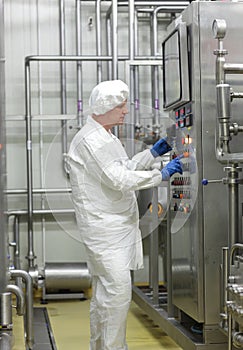 Biotechnology technician controlling industrial process