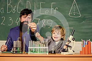 biotechnoloy research concept. bearded man teacher with little boy. Back to school. Explaining biology to child. father