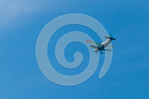 Biplane flying in blue sky