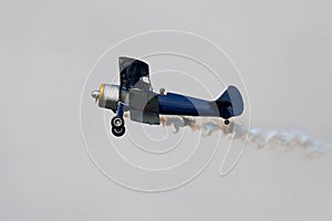 biplane smoke plume air show old aircraft