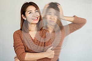 bipolar and smiling depression concept with Asian woman in difference mood