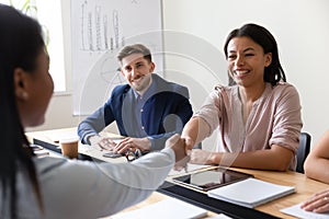 Biracial company executive manager handshake african client starting business meeting