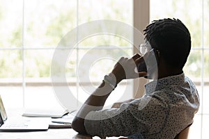 Biracial male employee talk with client on cellphone call