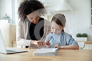 Biracial mom help Caucasian daughter with online lesson