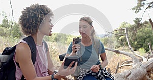 Biracial woman and Caucasian woman share a conversation outdoors