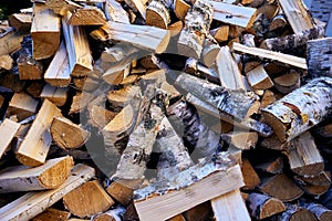 Birch chopped firewood piled in a pile. Clouse-up, pattern