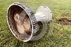 Bird bath garden columns pedestals on meadow.