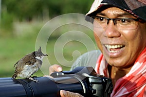 Bird on camera photographer