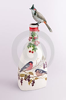 Bird on a decoupage bottle