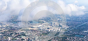 Bird Eye or Aerial View from plane window: Bangkok Cityscape on a sunny day. Air Transportation, Travel, Landscape, Urbanization,