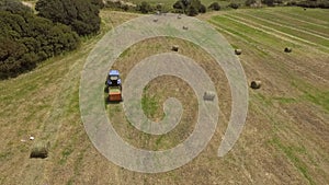 Bird eye of Hay rake tractor turning the hay