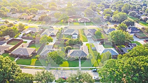 Bird eye view clean and peaceful neighborhood streets with row of single family homes near Dallas, Texas, USA